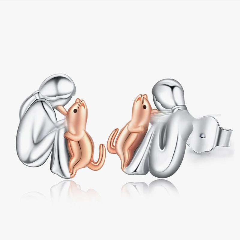 Petite Fille Câlinant un Chien – Clous d’Oreilles et Collier