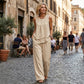 Ensemble femme composé d'un haut asymétrique et d'un pantalon à jambes larges